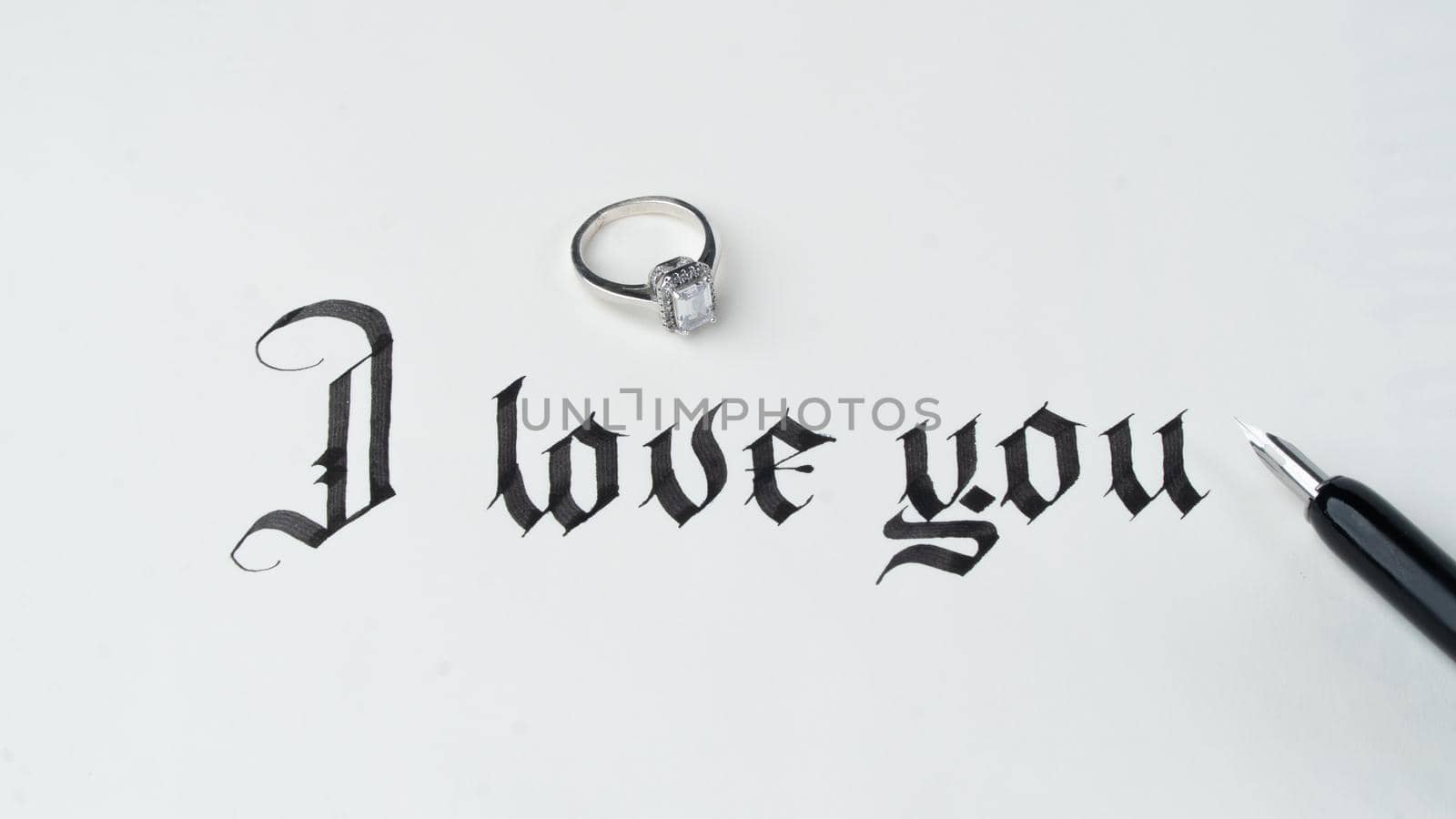 Engagement, love letter with ring, inscription I love you calligraphy by voktybre