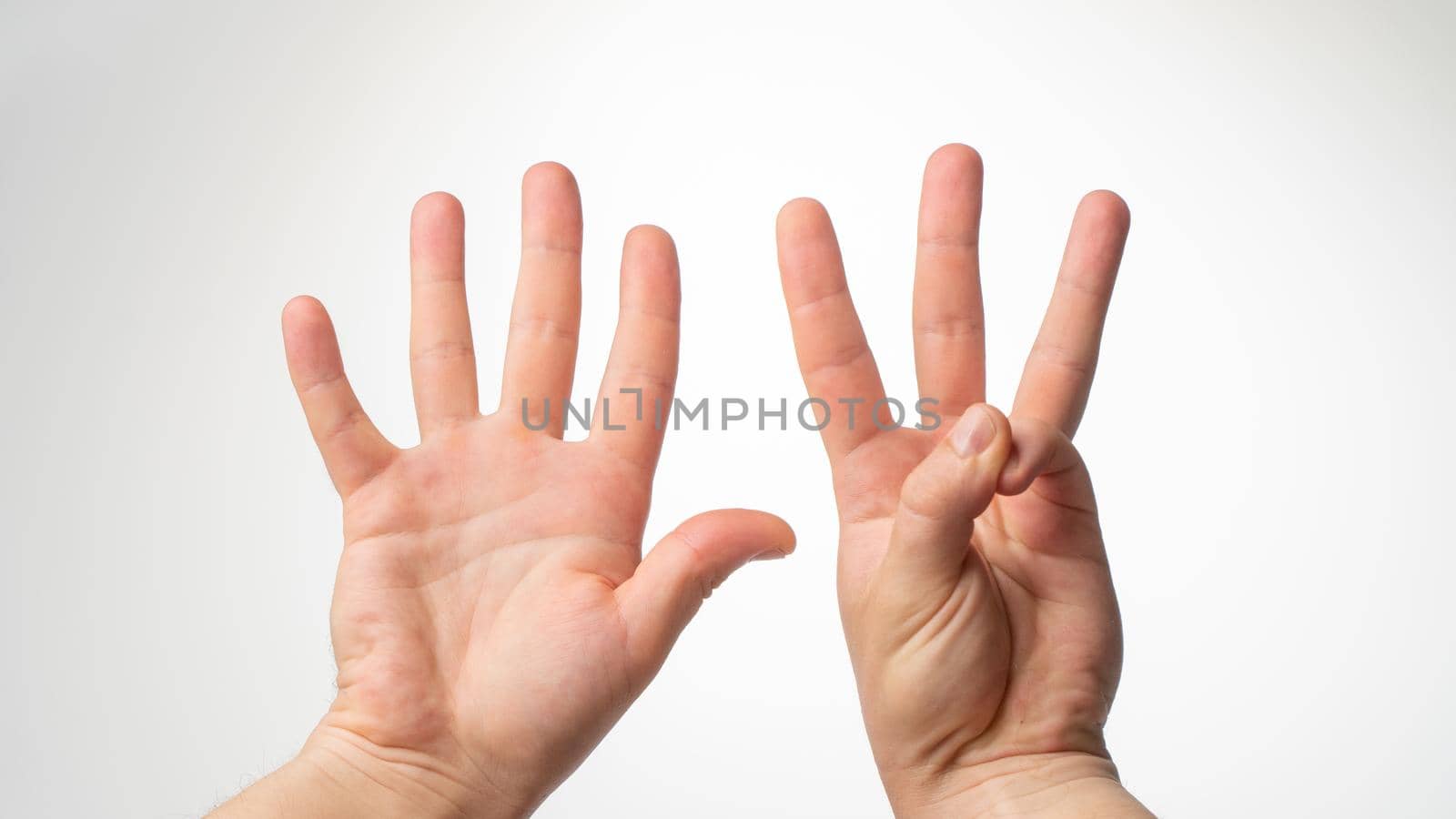 Men's hands gesture counting on fingers eight palmar side by voktybre