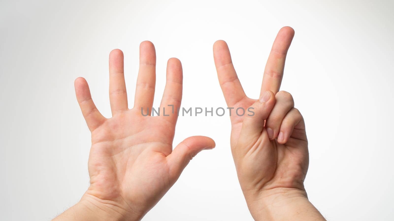 Men's hands gesture counting on fingers 7 palmar side. High quality photo