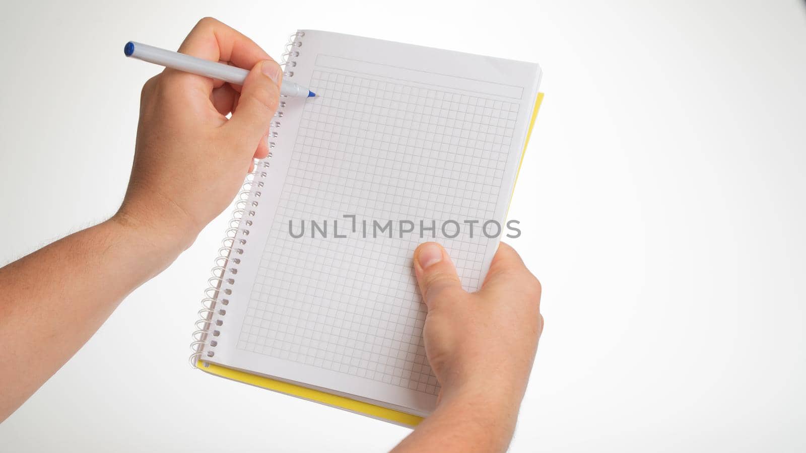 Men's hands hold a notebook in a cage left hand with a left-handed pen lefty by voktybre