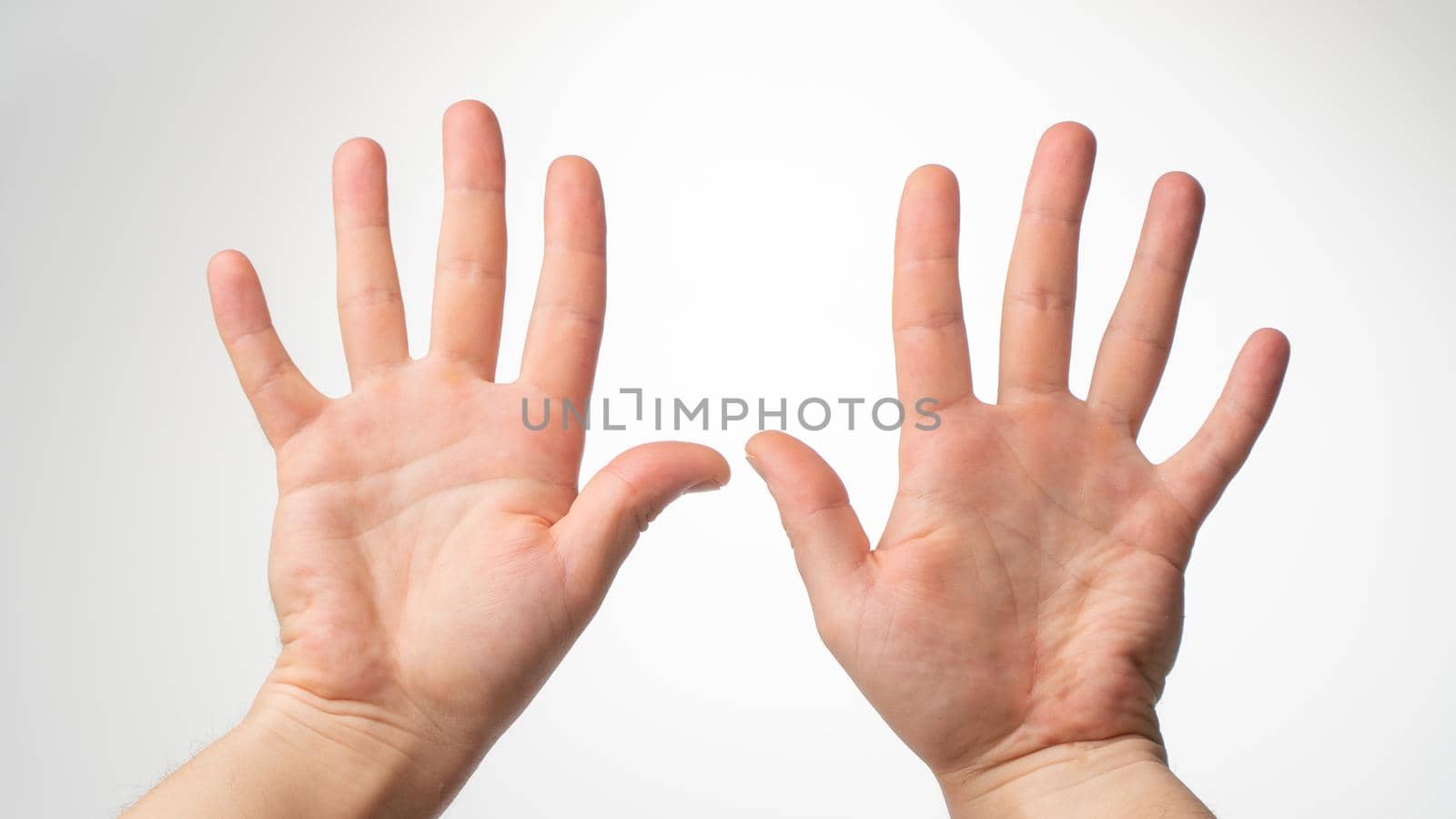 Men's hands gesture counting on fingers 10 palmar side. High quality photo