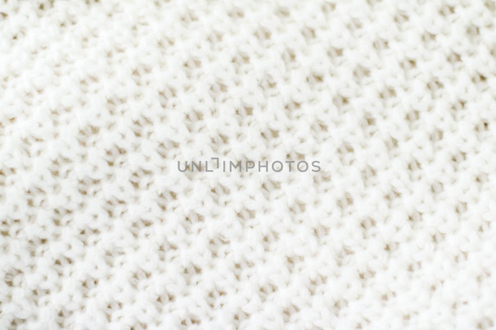 Knitwear, fabric textures and handmade items concept - Warm knitted clothes, soft and white