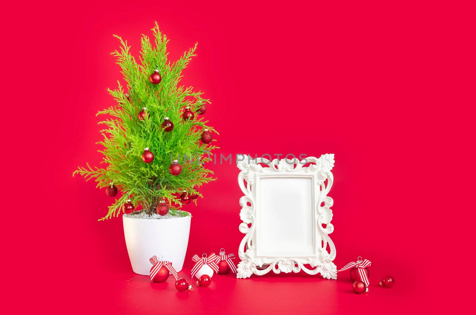 New Year's mockup, on a red background a Christmas tree and a frame for text