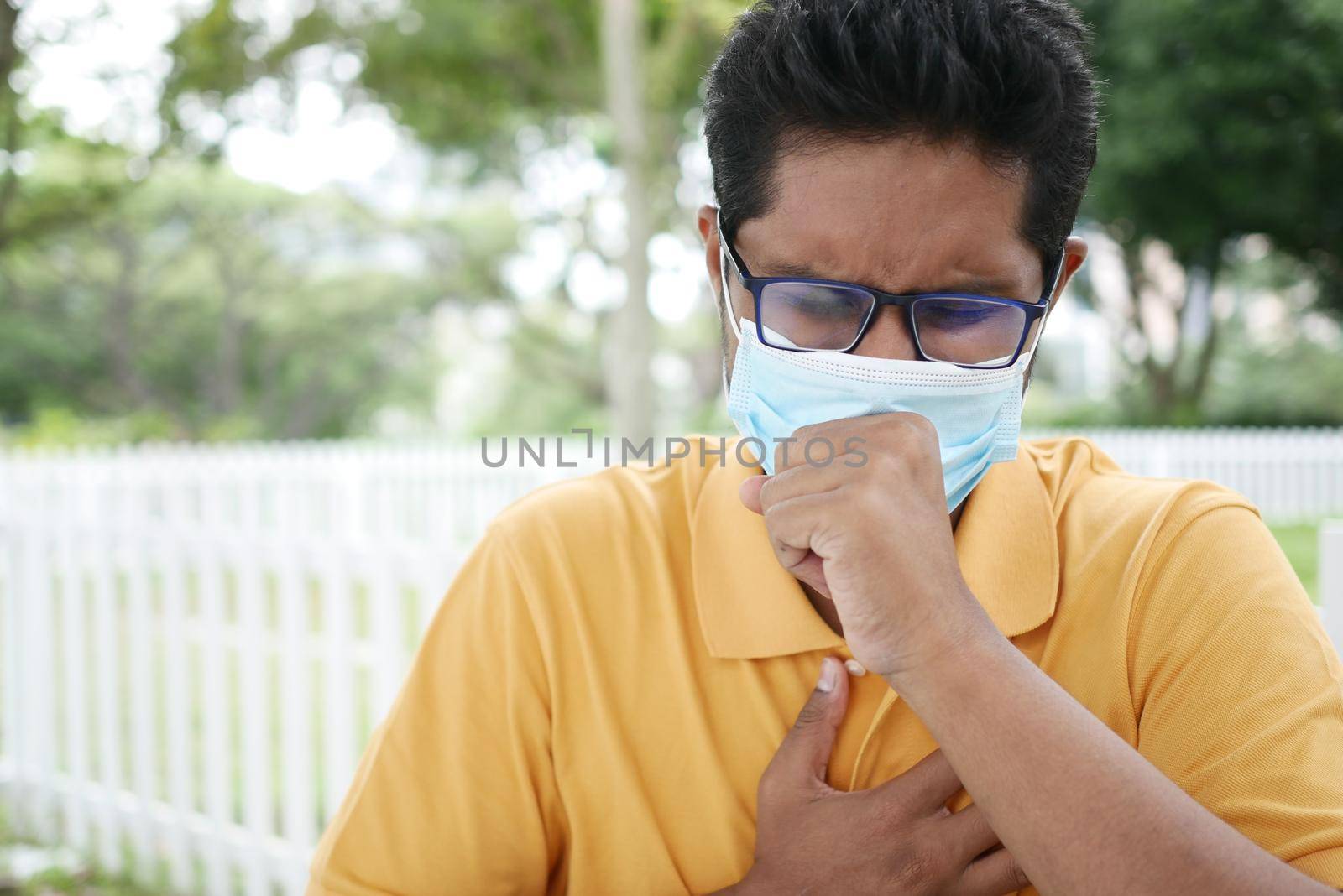 Sick man got flu allergy sneezing and blowing nose