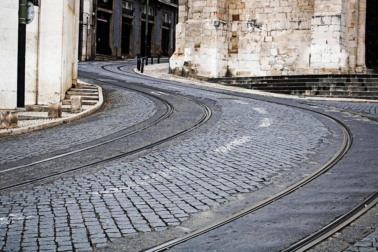 S shaped trolley car rail in a street in Lisbon Portugal