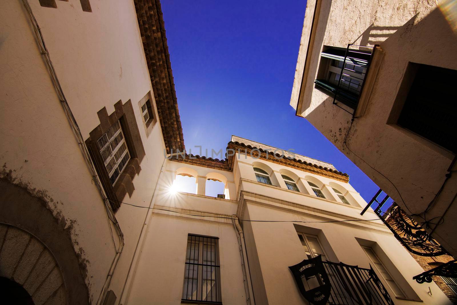 Classic houses and the sun view from below in Sitges Barcelona