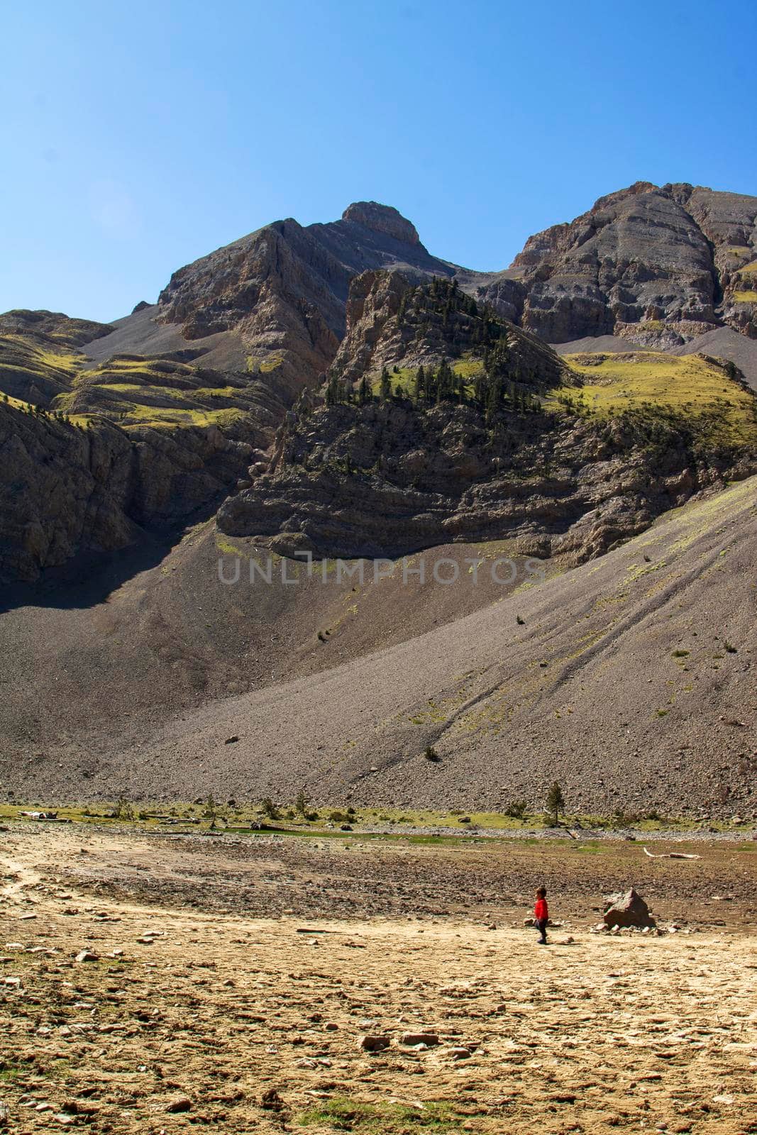 Lonely kid in Ibon de Plan in Huesca Spain by ValentimePix