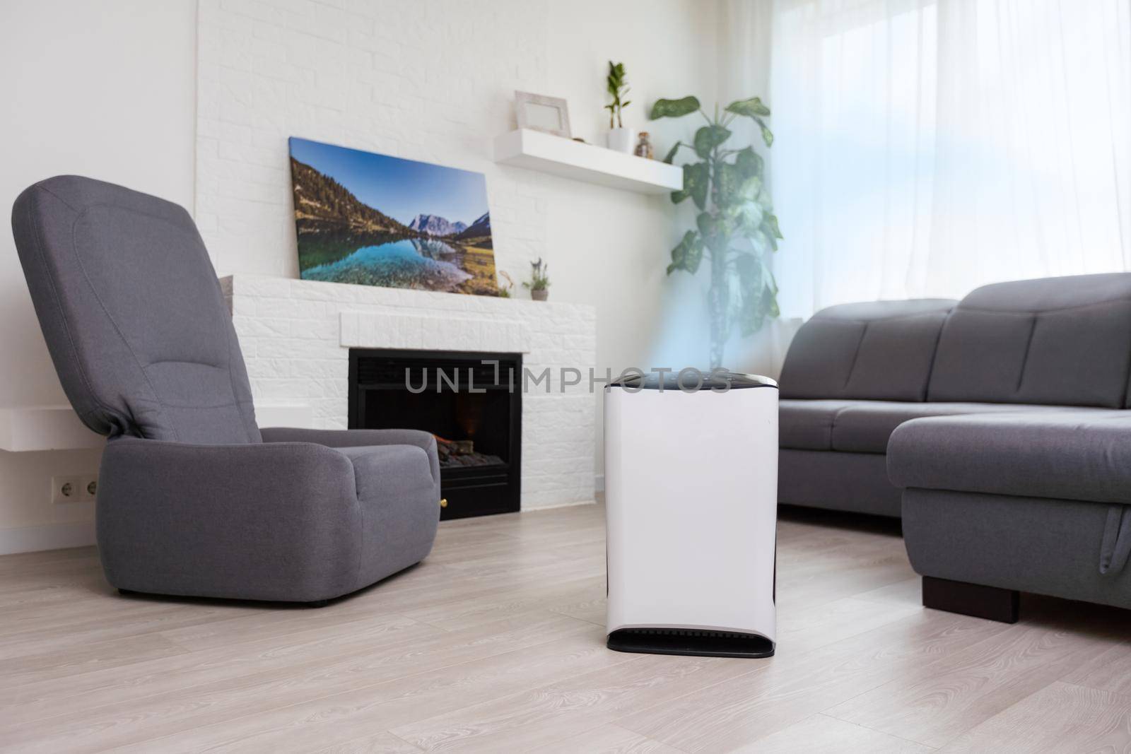 Air purifier on blue with filter for cleaner removing fine dust PM2.5.