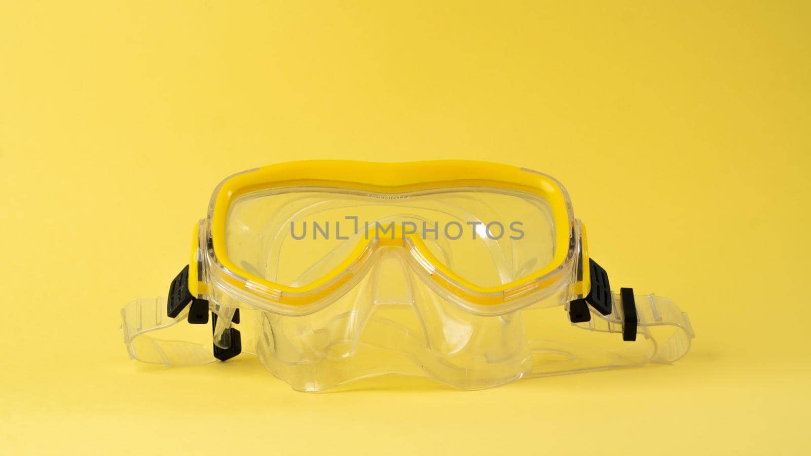 Yellow scuba diving mask on a yellow background, color aesthetics by voktybre