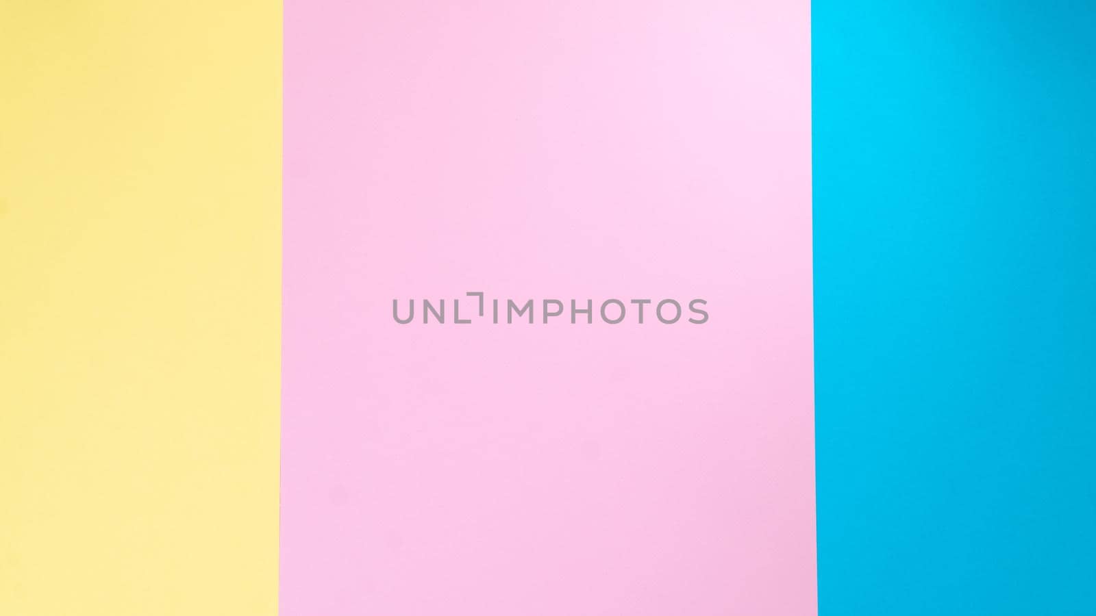 Background stripes in three colors - yellow, pink, blue paper. High quality photo