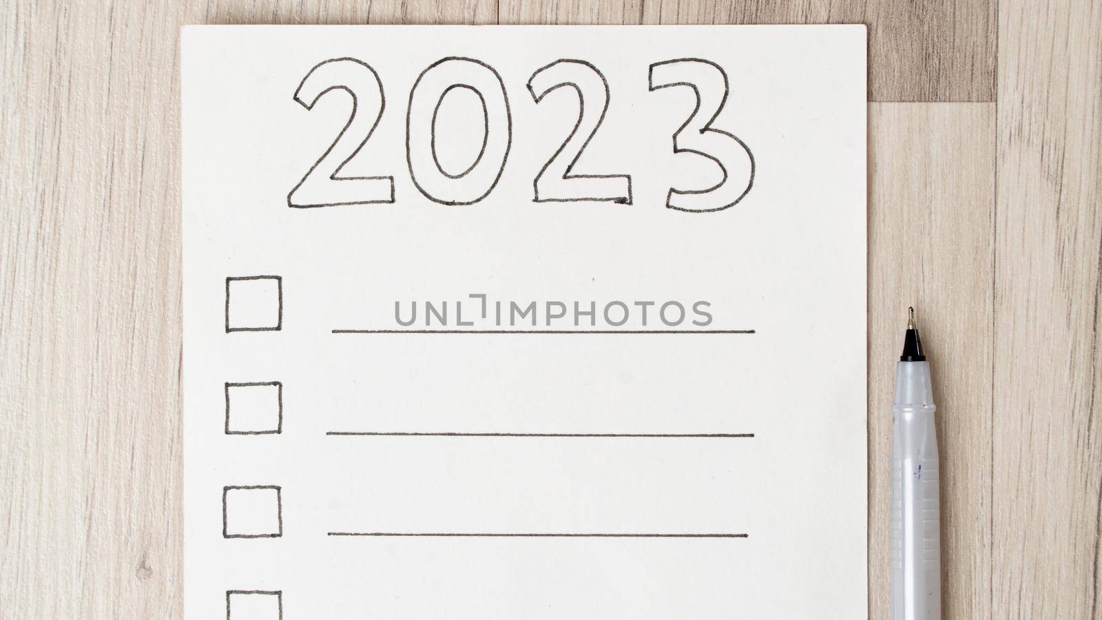 To-do list for 2023 on a white sheet with squares for checkmarks and lines for inscription by voktybre