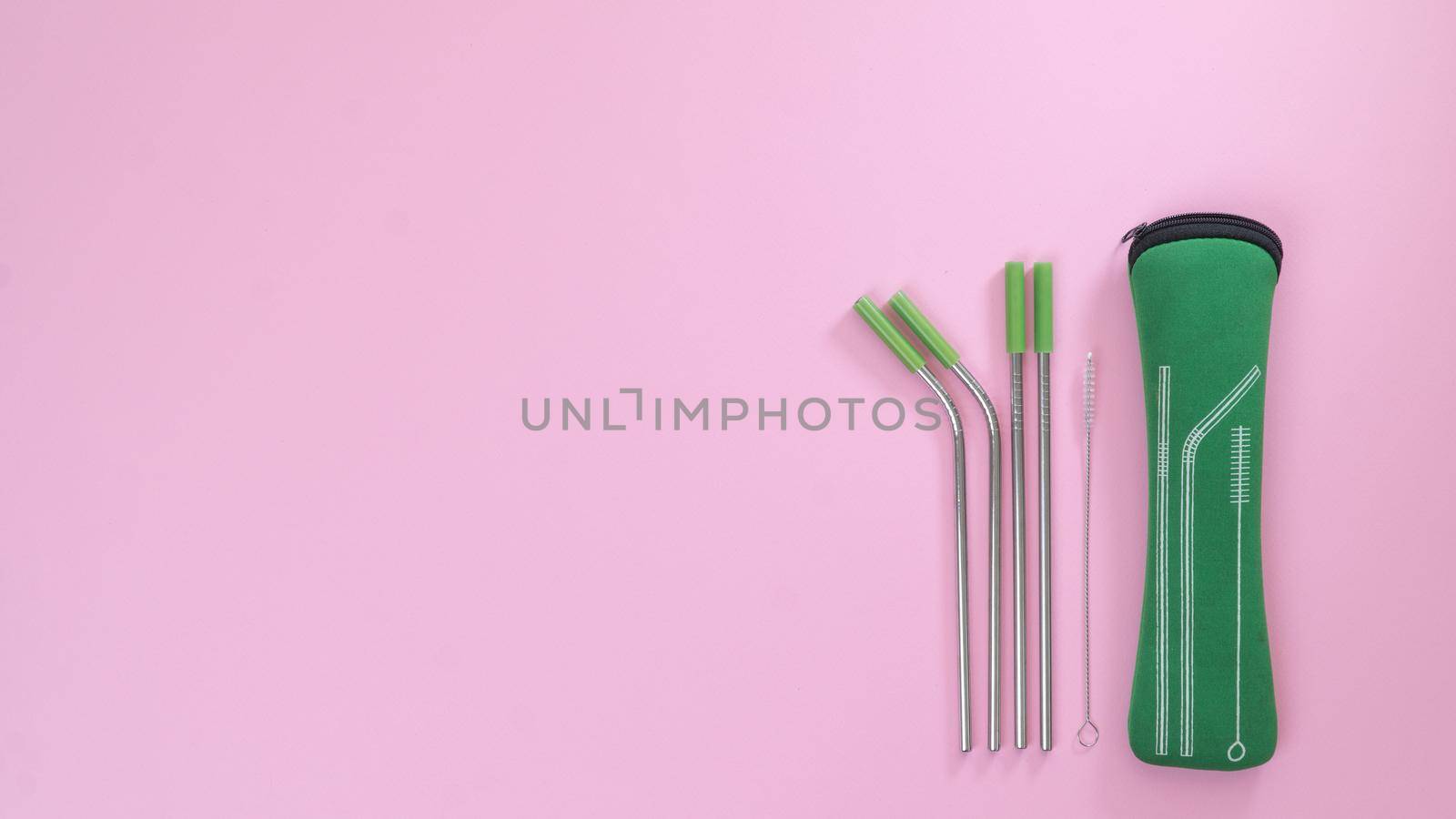 Reusable metal straw set with cover and cleaning brush. High quality photo