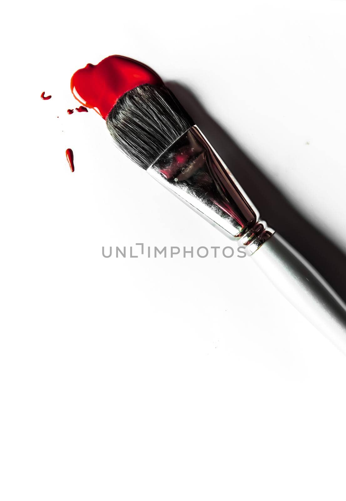 Beauty texture, cosmetic product and art of make-up concept - Brush and liquid foundation close-up isolated on white background