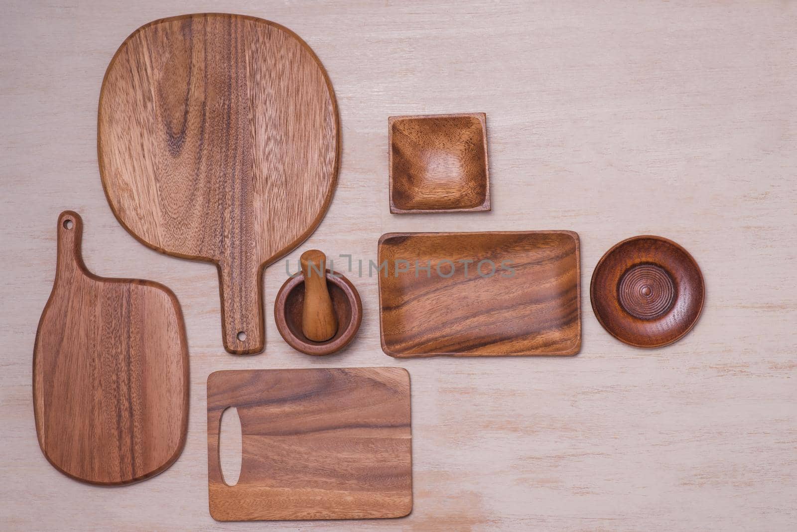 Set of kitchen utensils on vintage planked wood table from above, wooden background by makidotvn