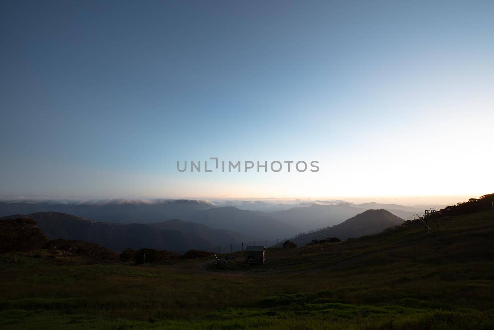Landscape views of sunset from the summit of Mt Buller over the Victorian Alps in the Victorian High Country, Australia