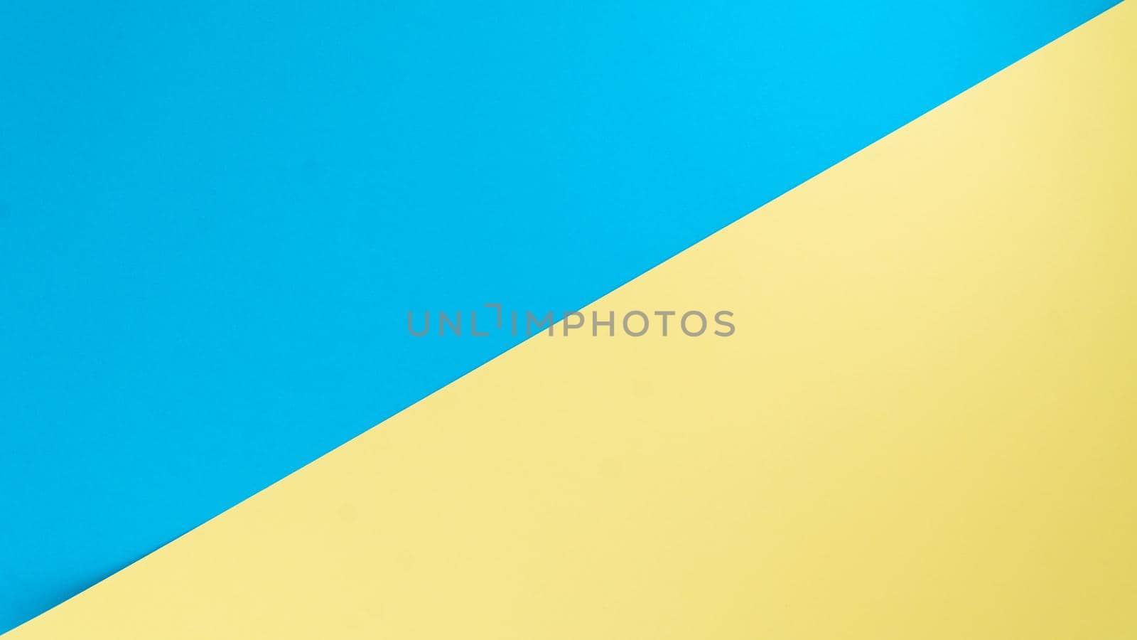 Background - two colors separate diagonal yellow and blue. High quality photo