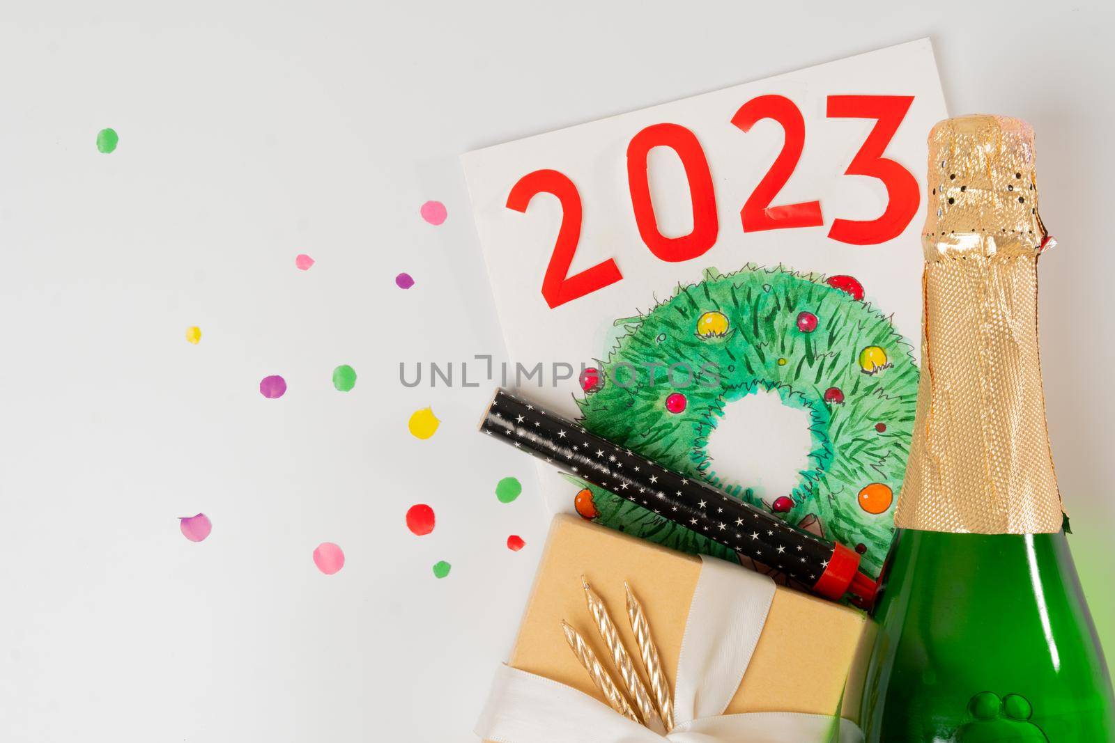 Champagne, gift, firecracker and Christmas wreath card 2023. High quality photo