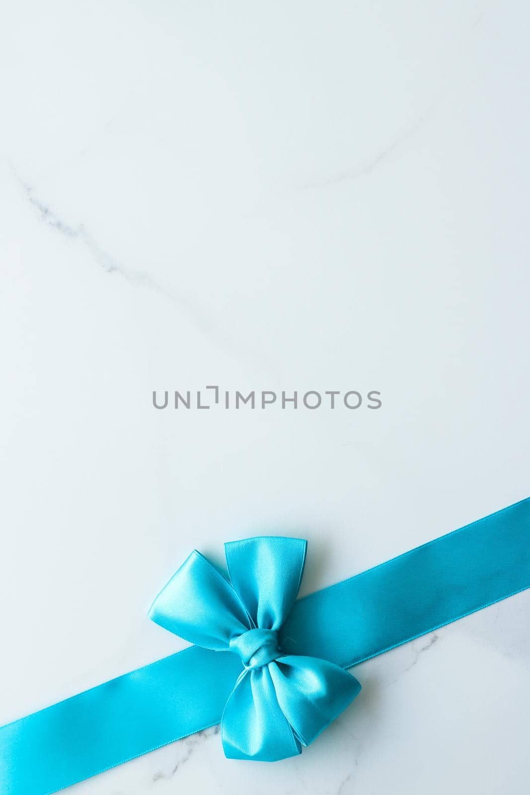 Holiday decor, feminine design and flatlay concept - Blue silk ribbon on marble, top view