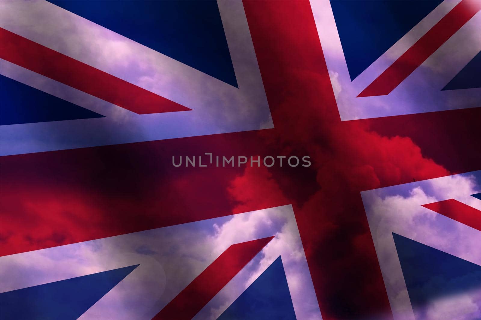 Waving the national flag of Great Britain against the background of blue and red clouds