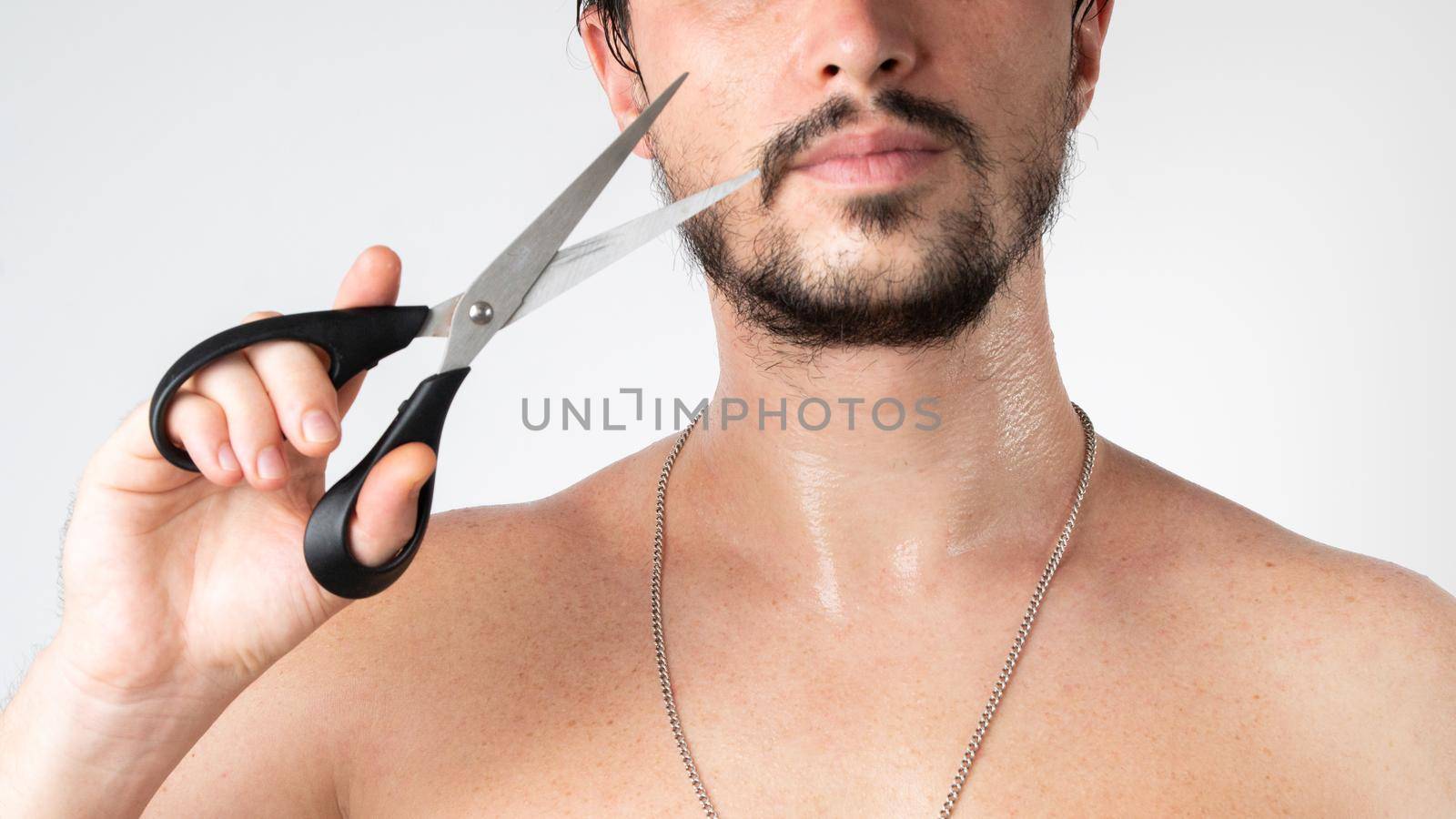Haircut and styling of beard and mustache - a man with scissors, self-care at home by voktybre