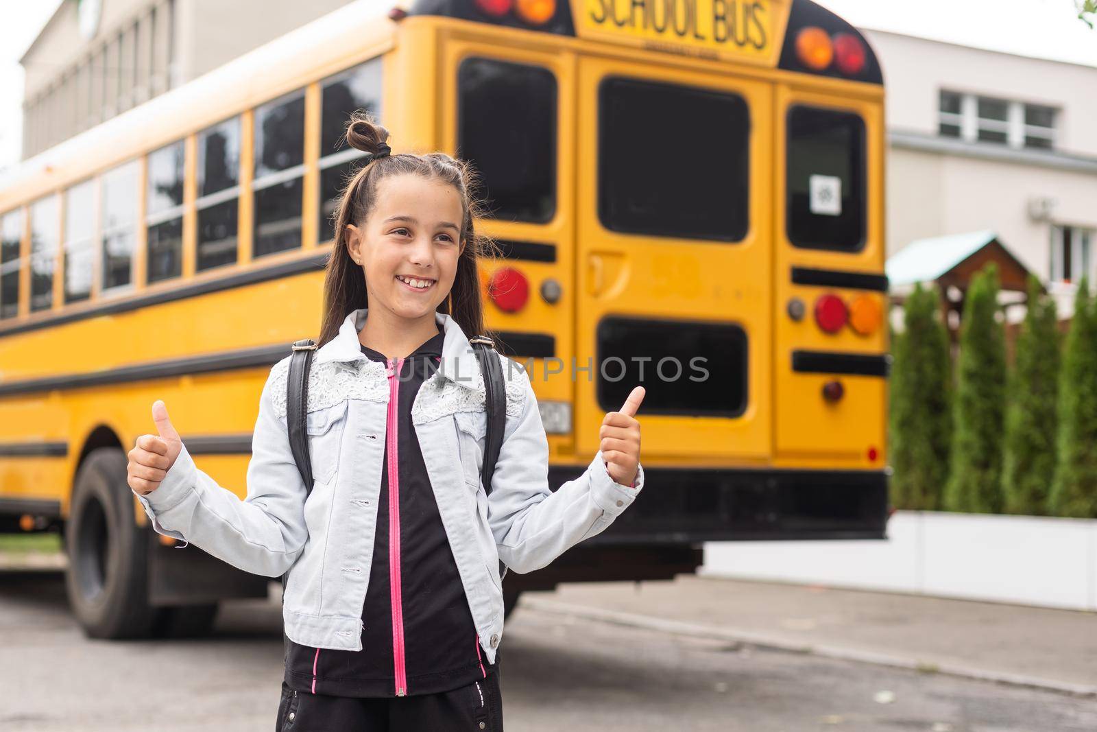 First day of school. Happy child girl elementary school student runs to class. concept back to school. by Andelov13