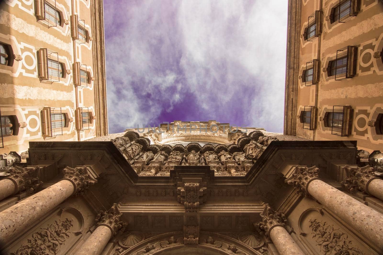 Montserrat monastery facade under a cloudy sky by ValentimePix