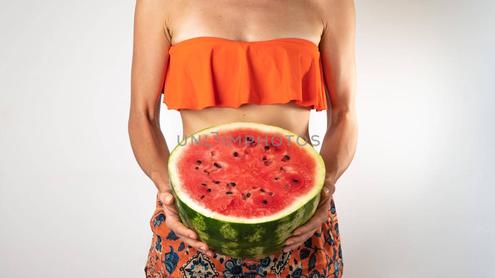 Woman in bathing suit - orange shorts and top with half a watermelon in her hands - summer wave by voktybre