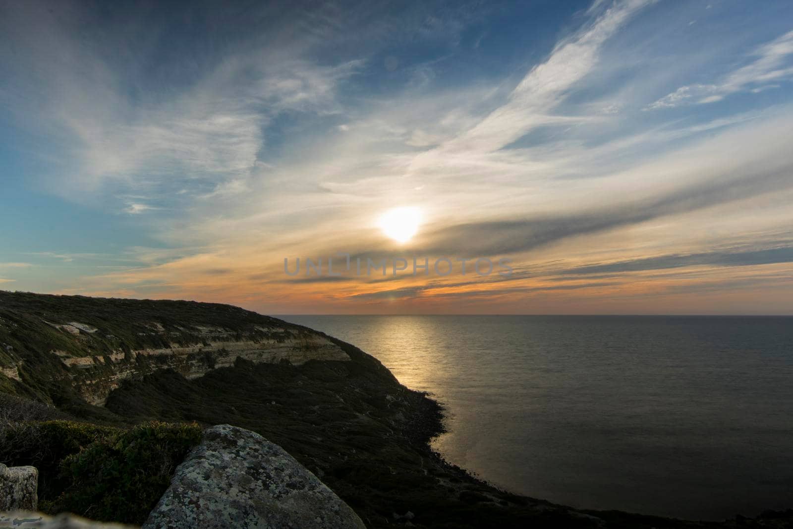 Sunset landscape showing Cape San Marco in Sardegna island in Italy in a long exposure picture