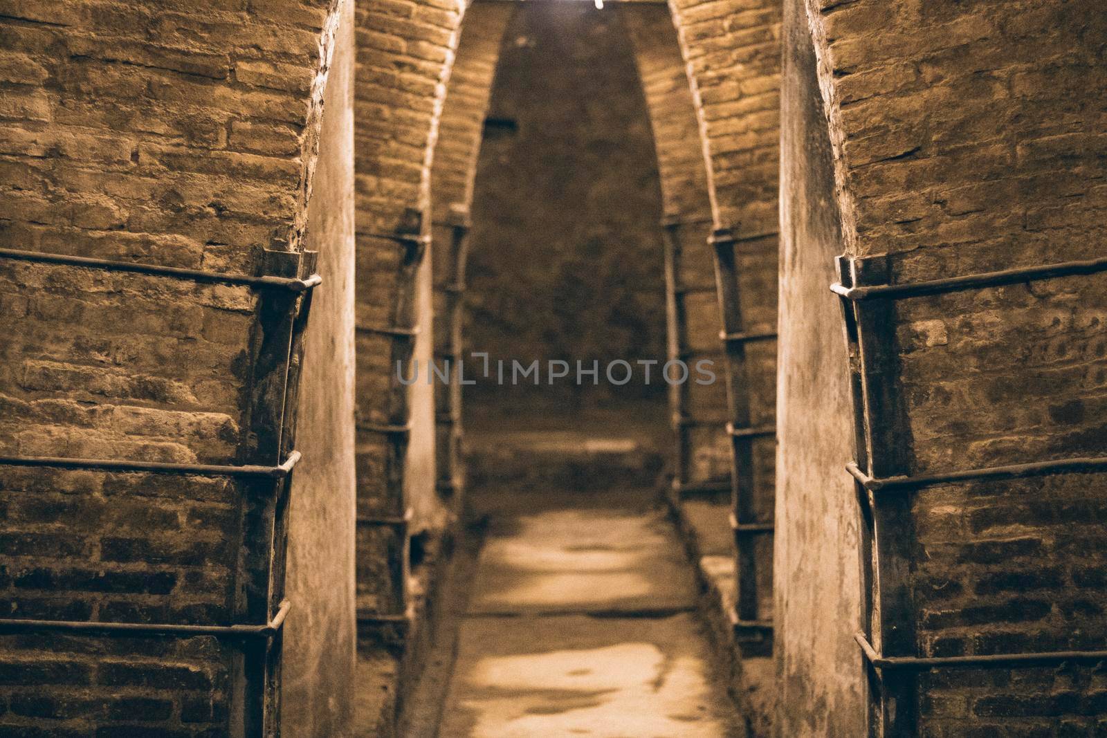 Corridor perspective enlightened in an old oil cellar