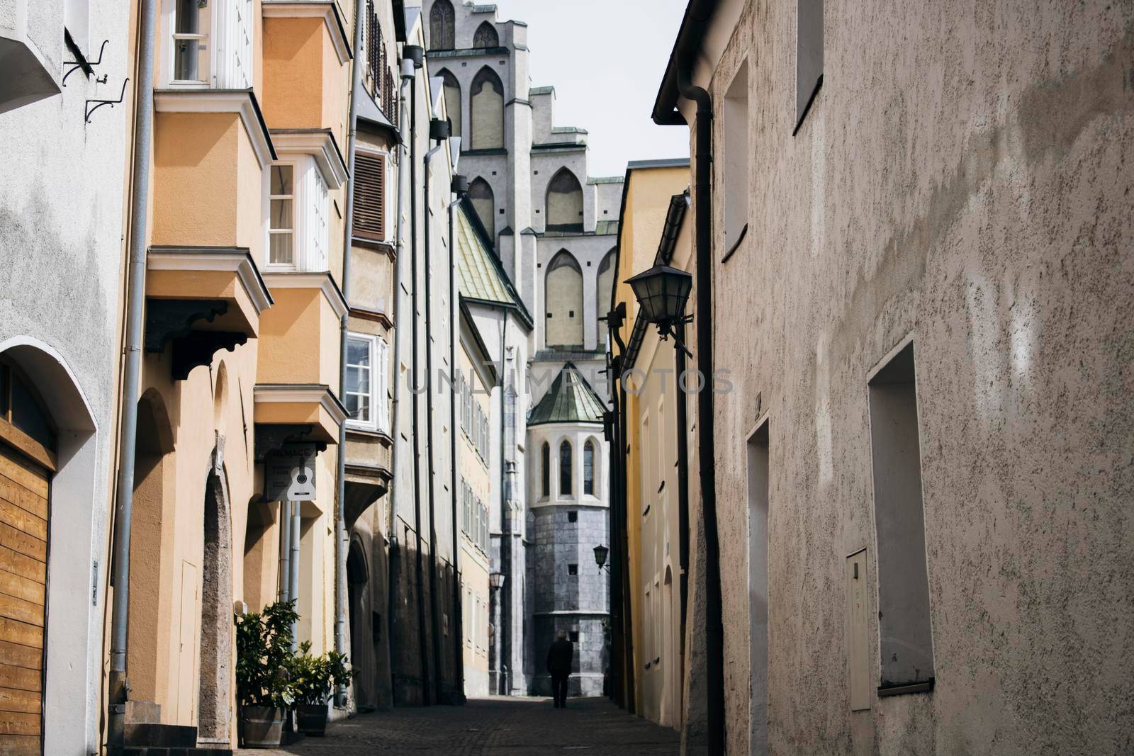 Man walking in an old town by ValentimePix