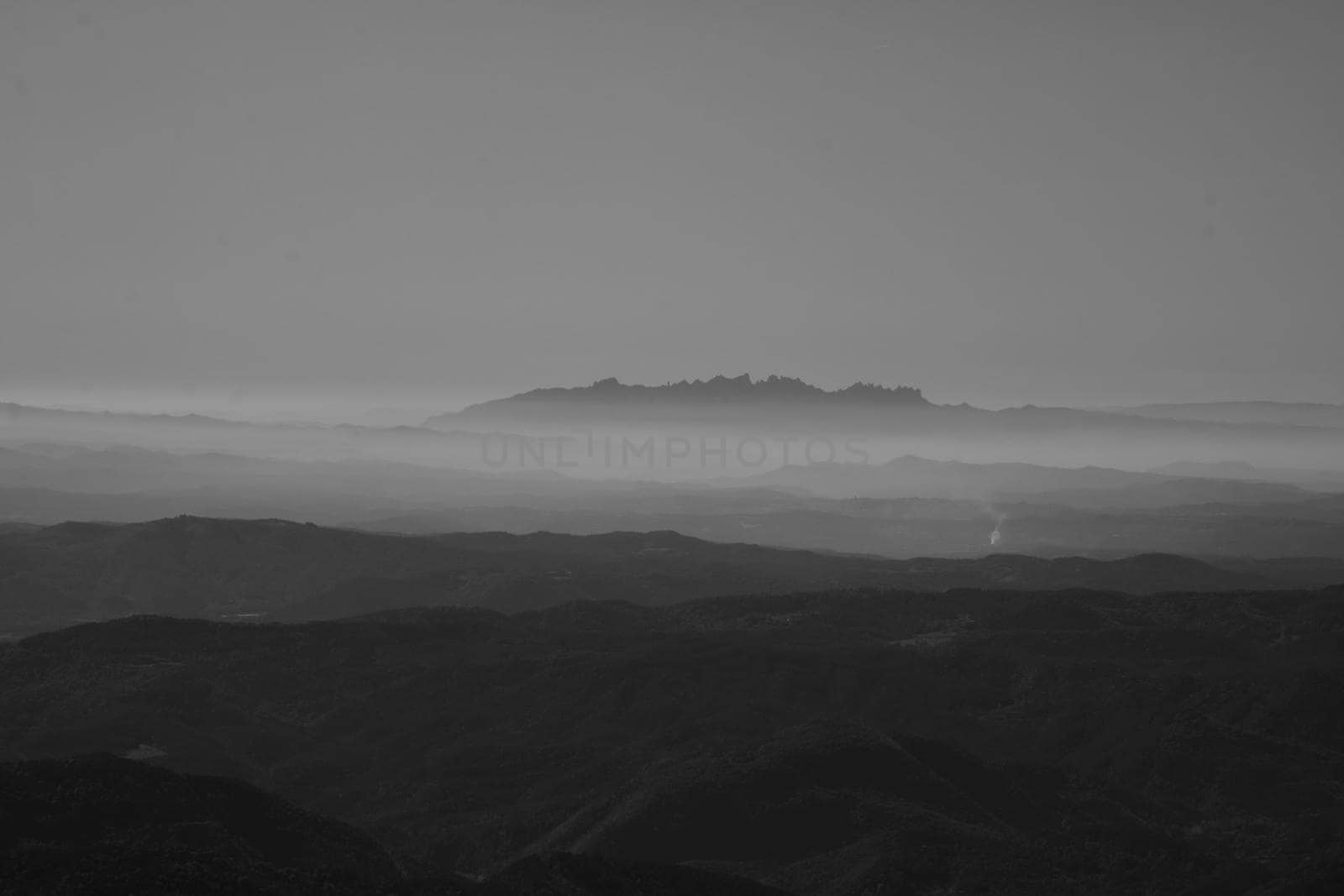 Montserrat mountain surrounded by mist in a minimalistic landscape picture