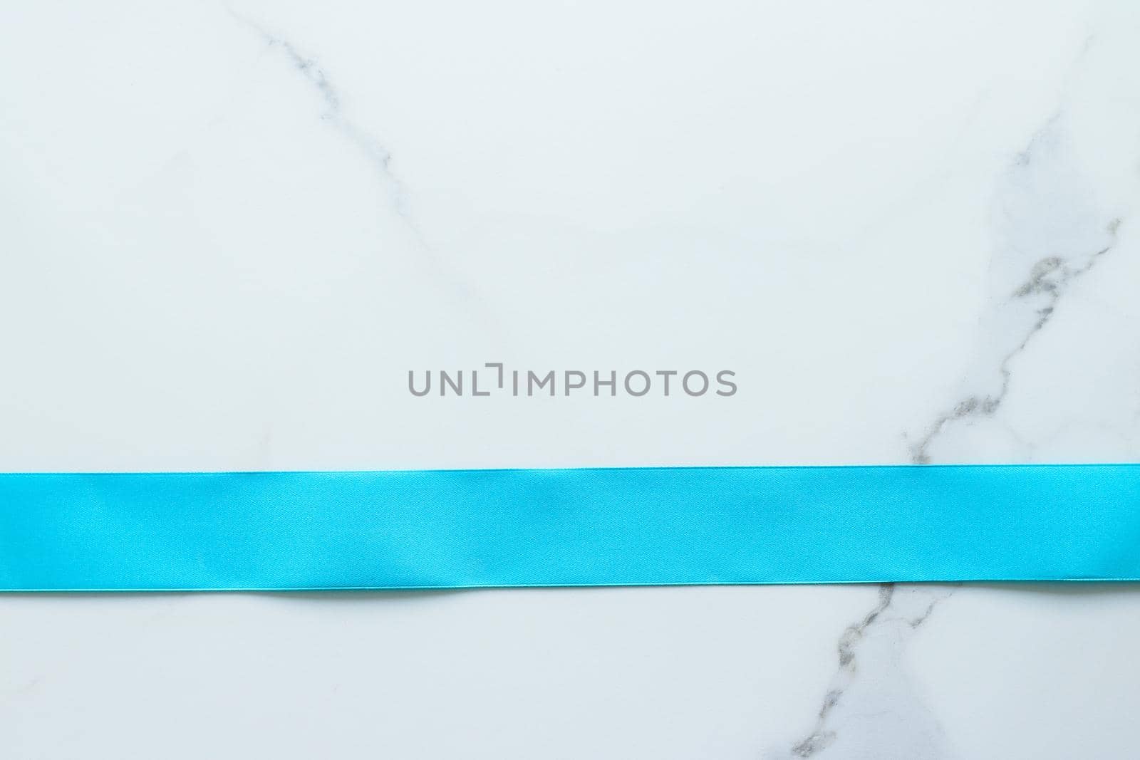 Holiday decor, feminine design and flatlay concept - Blue silk ribbon on marble, top view