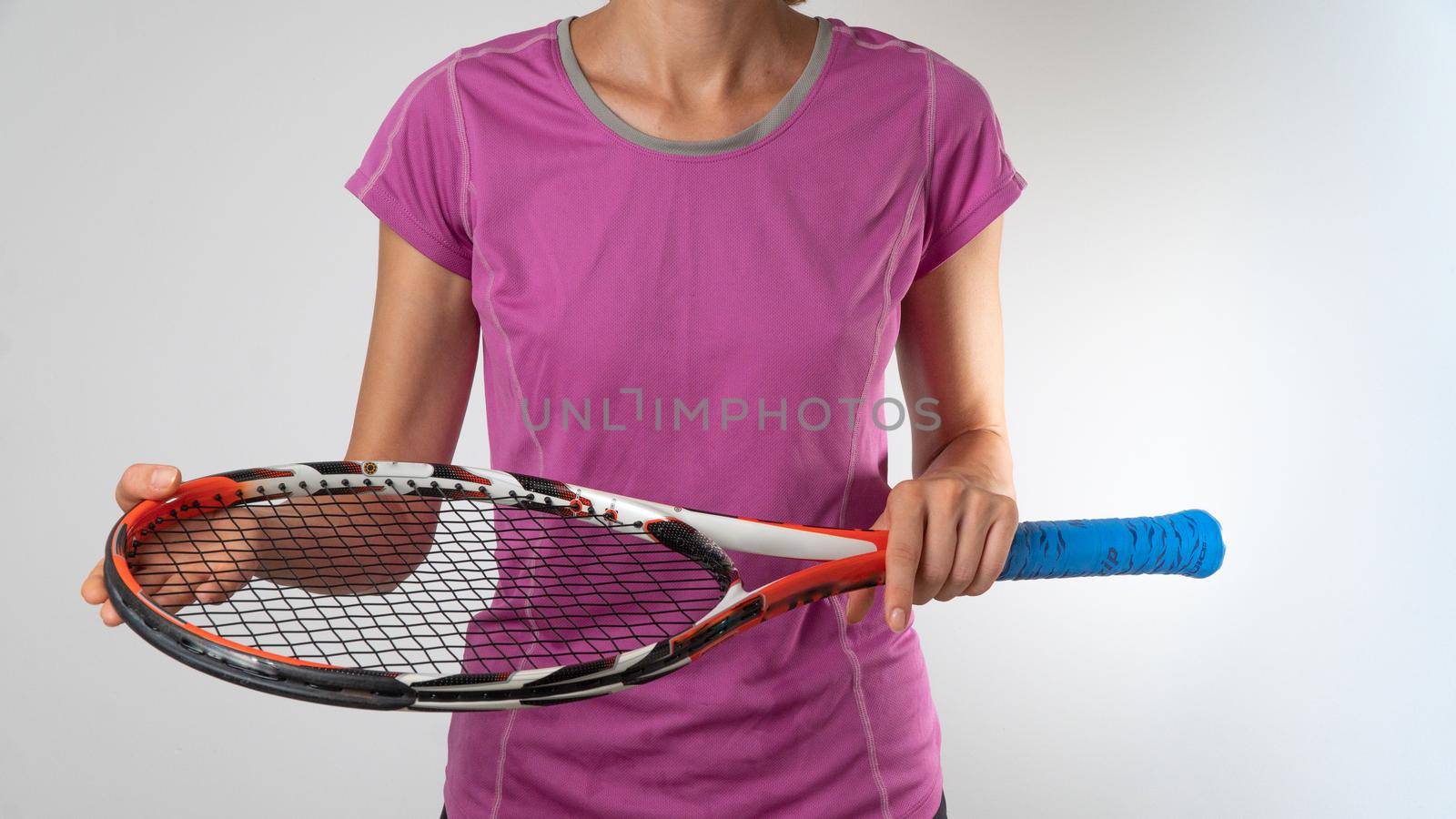 Woman with tennis racket on white background. High quality photo