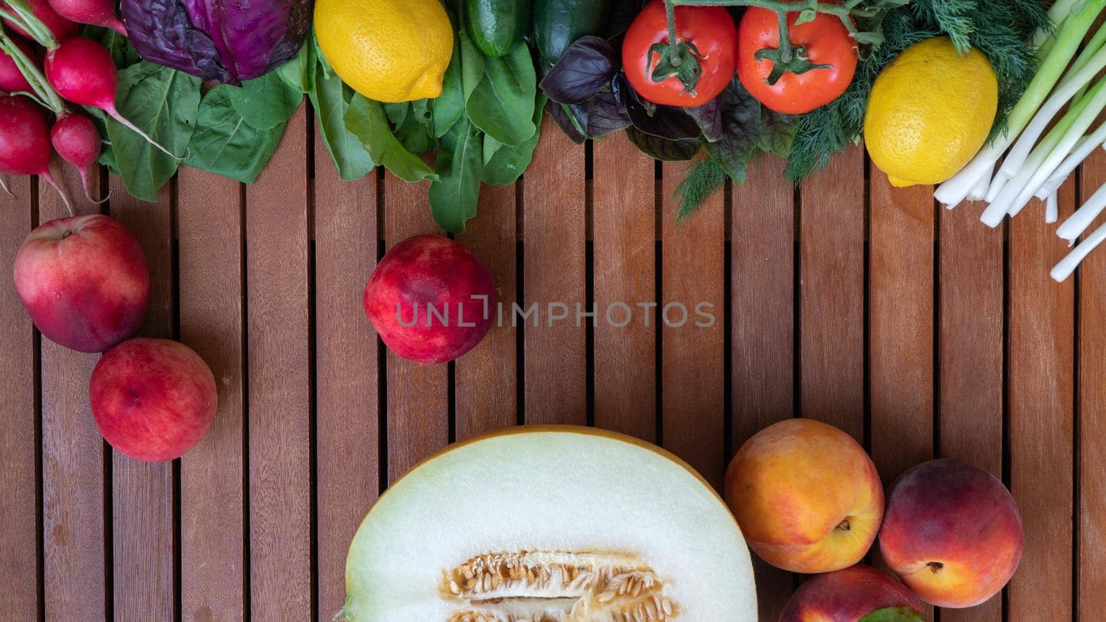 Different fruits and vegetables on the table made of wood background - vegetable and fruit mix. High quality photo