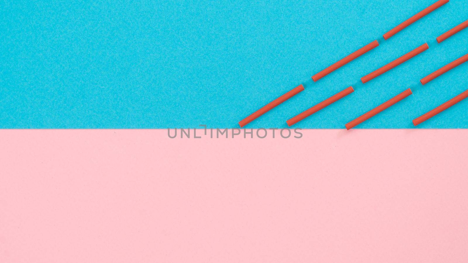 Parallel strokes of red wire on a two-tone background, abstraction. High quality photo