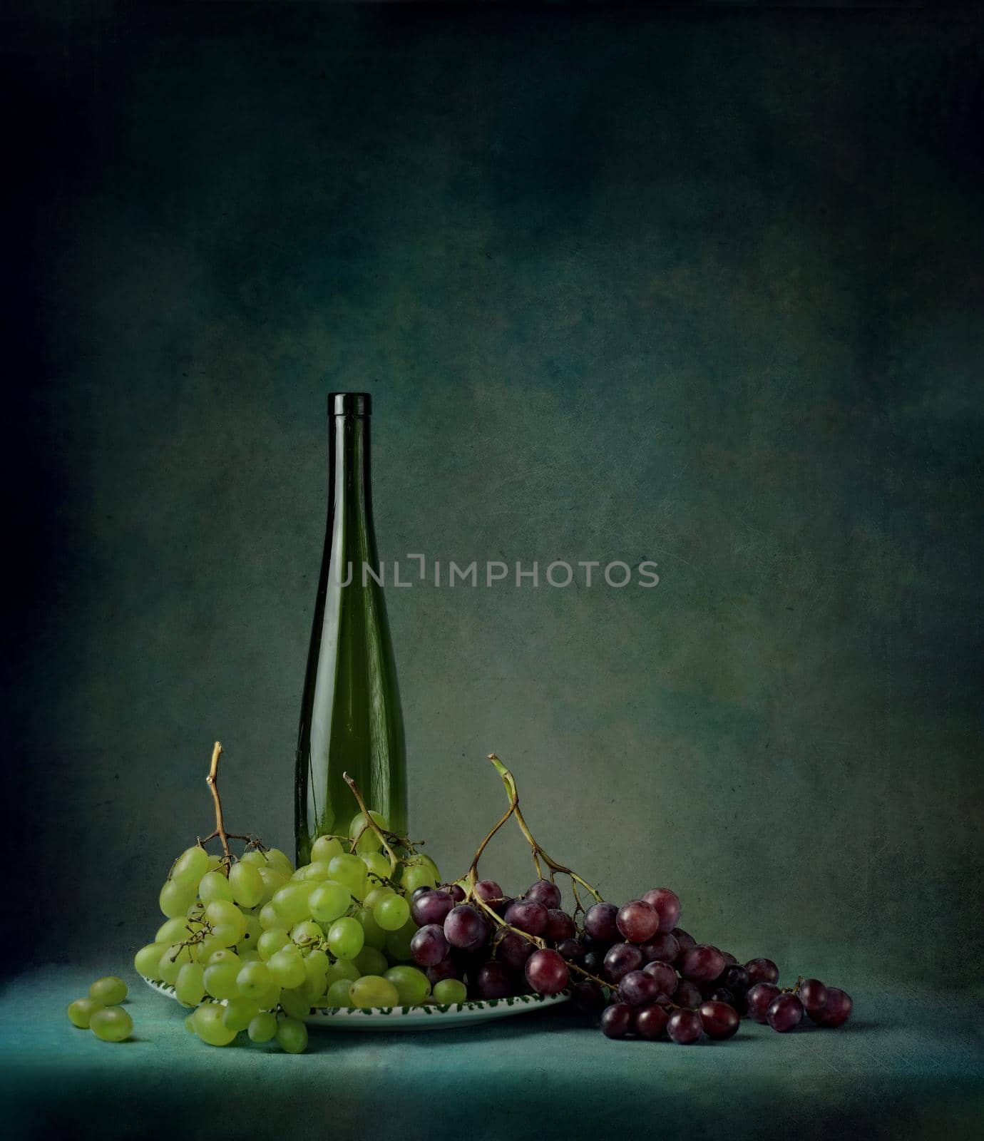 still life of berries and fruits on the table on a dark background photo