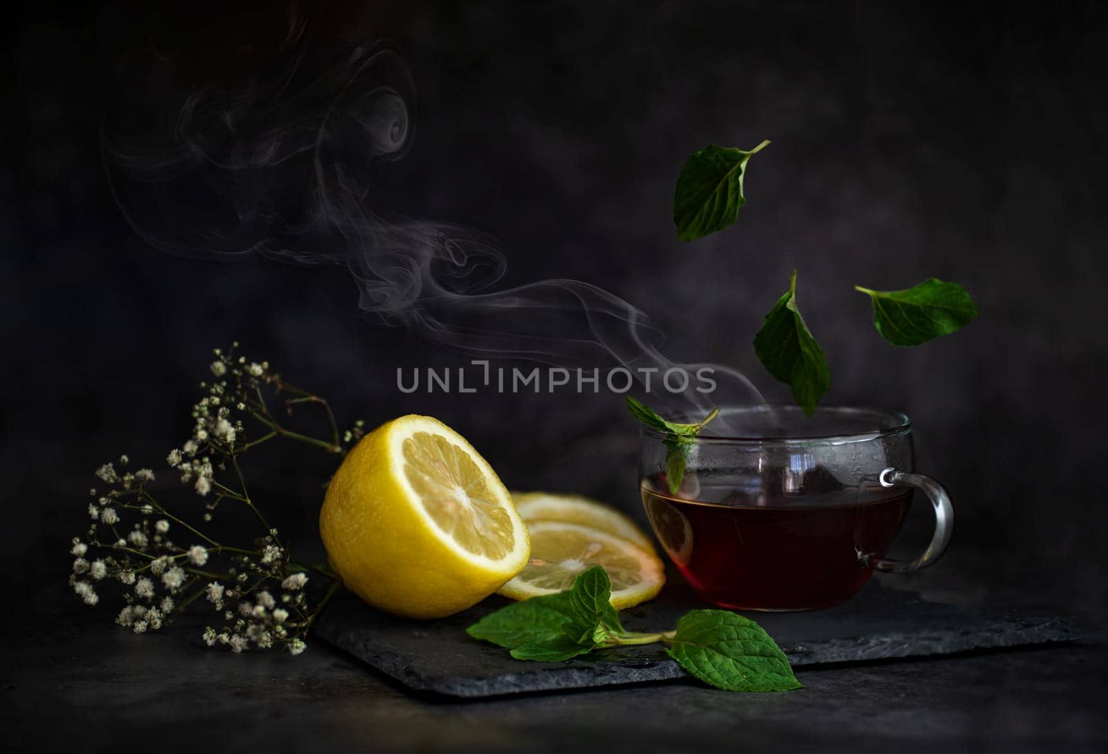 still life of berries and fruits on the table on a dark background photo