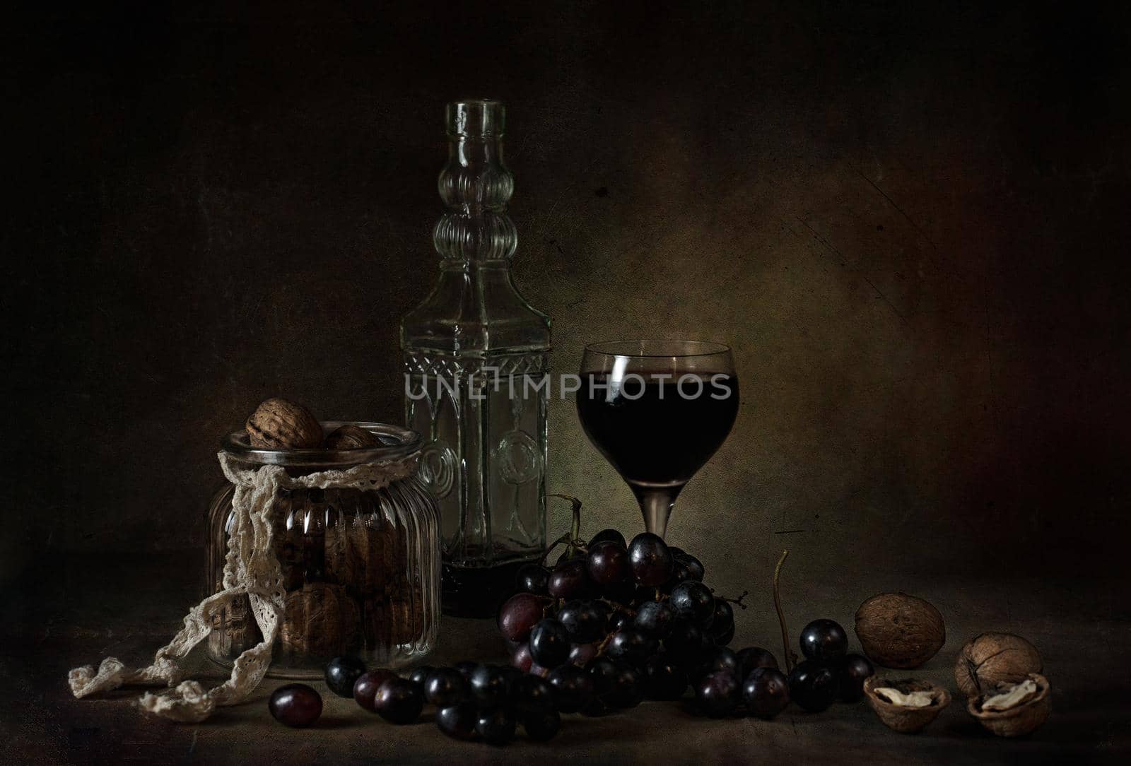 still life of berries and fruits on the table on a dark background photo