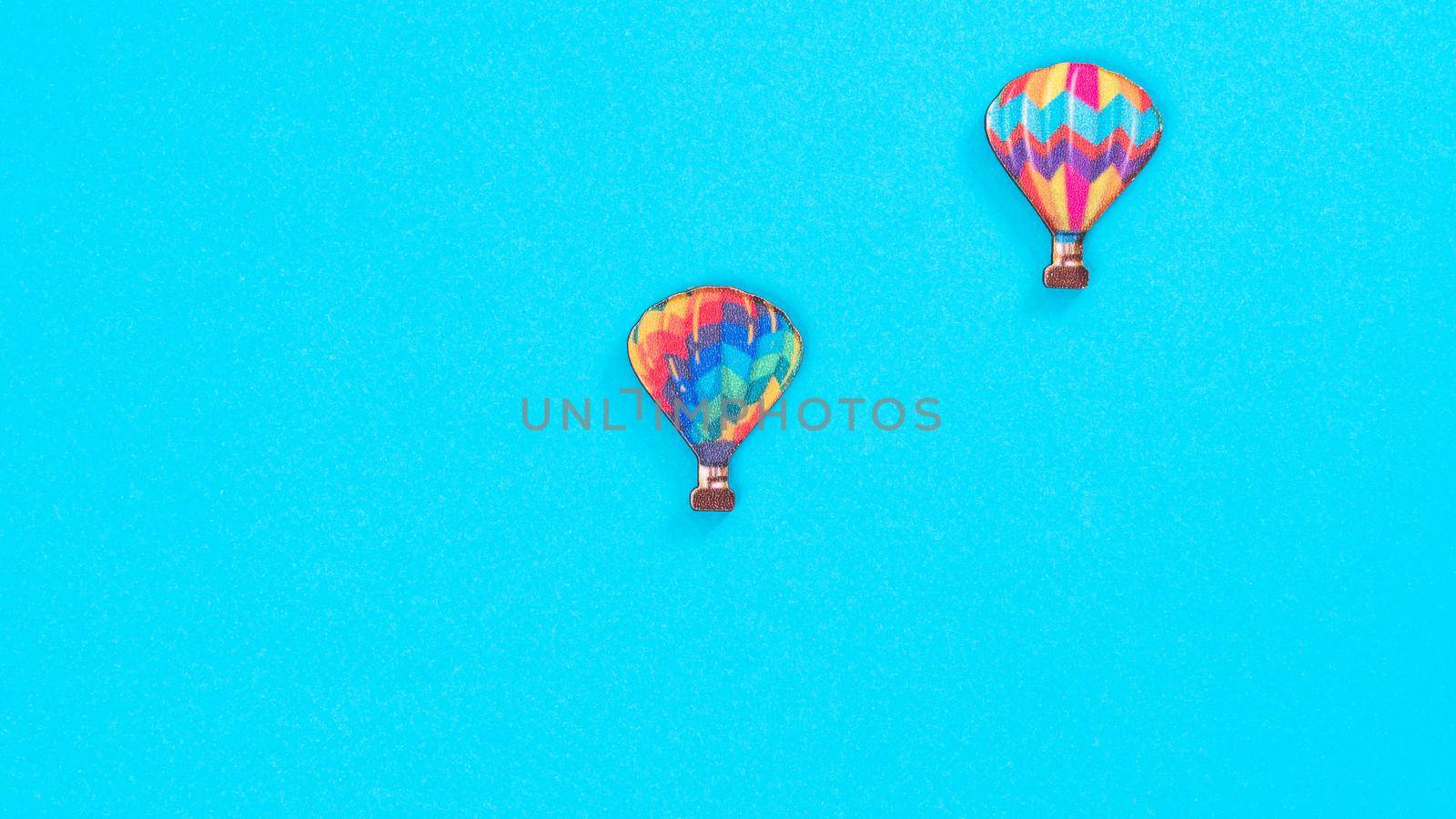 Toy air balloons on a blue background with space for inscription by voktybre