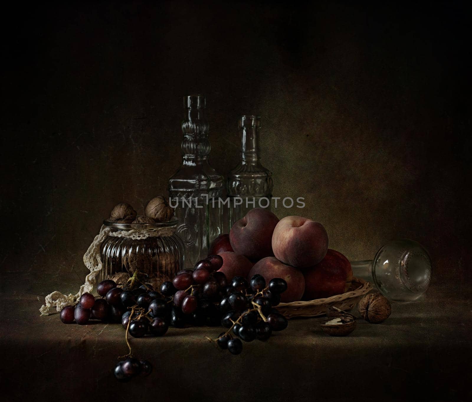 still life of berries and fruits on the table on a dark background photo