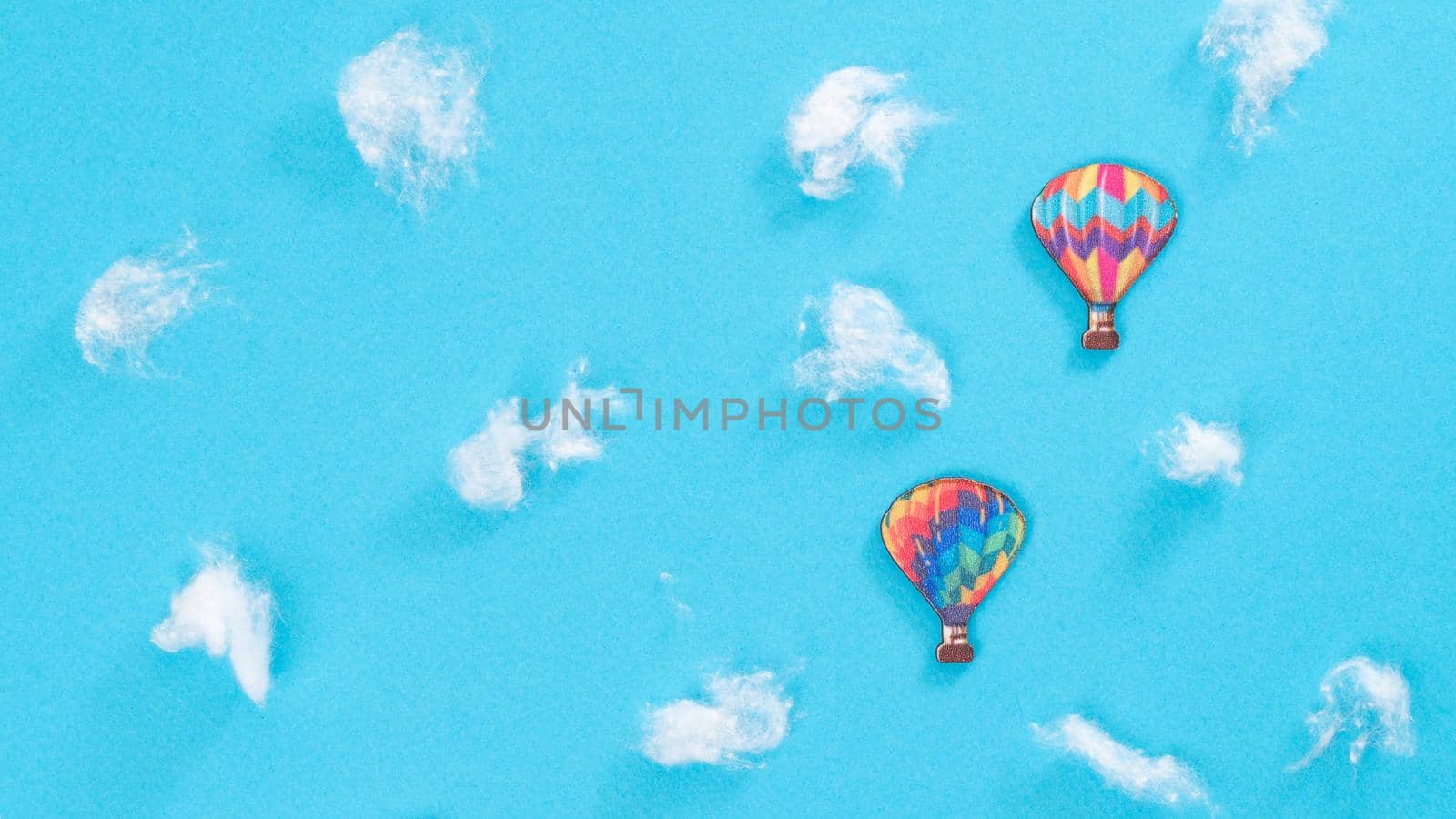 Two colorful air balloons among the white clouds by voktybre