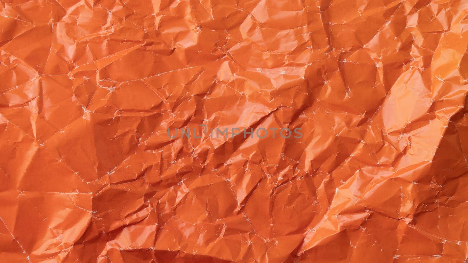 Wrinkled colored paper background texture voluminous orange by voktybre