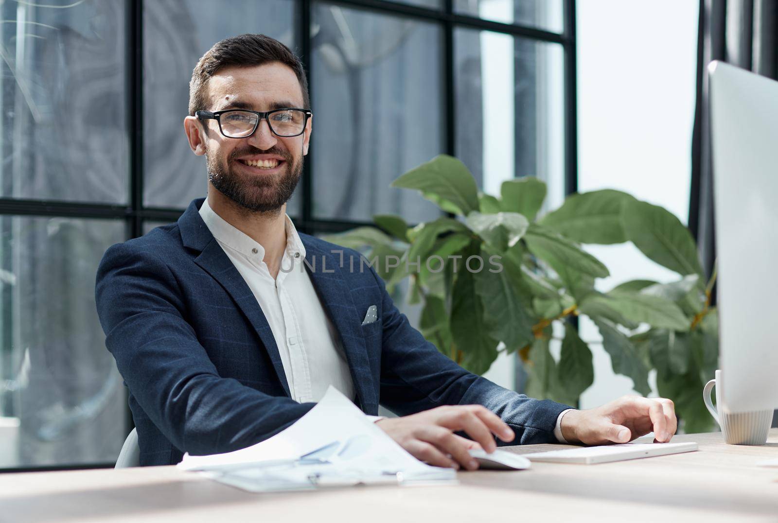 Confident man wearing headset speaking and watching business webinar training, listening to lecture