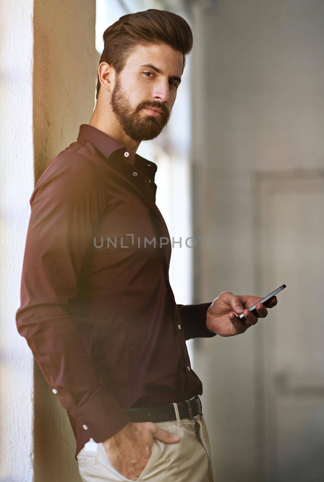 Efficient communication brings quicker results. Cropped portrait of a businessman sending a text in his office