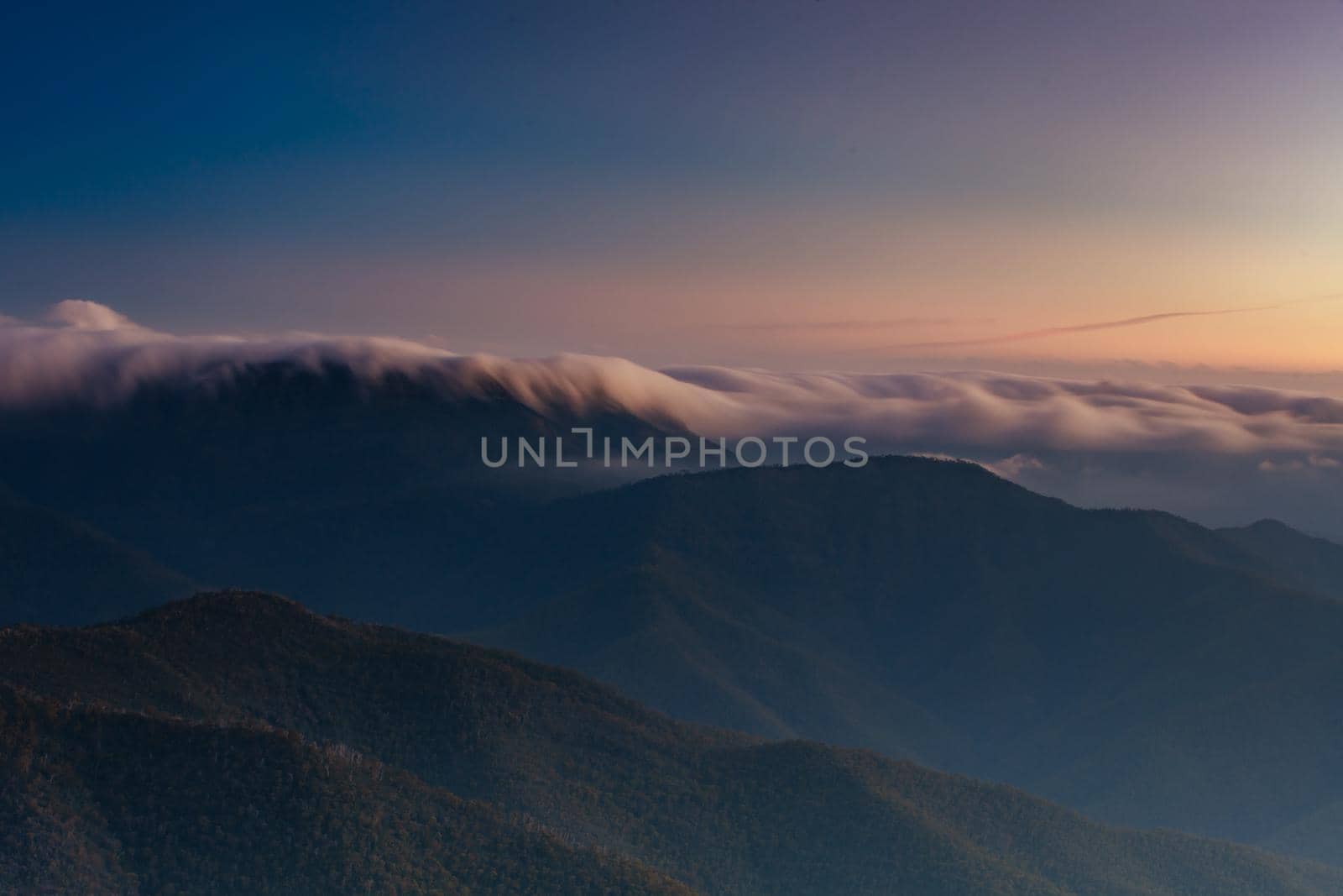 Landscape views of sunset from the summit of Mt Buller over the Victorian Alps in the Victorian High Country, Australia