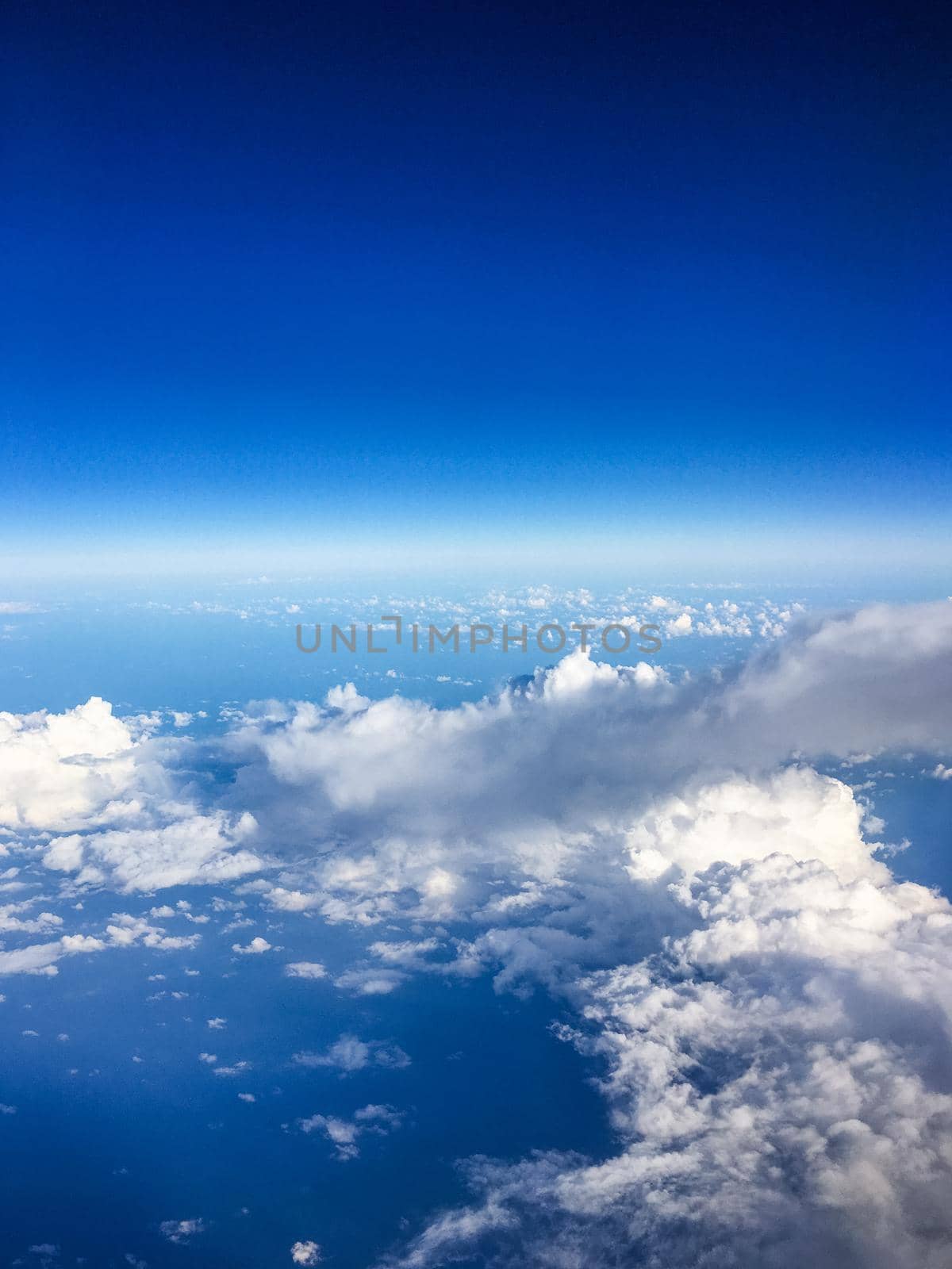 View from the airplane window, sky and ocean blue by Anneleven