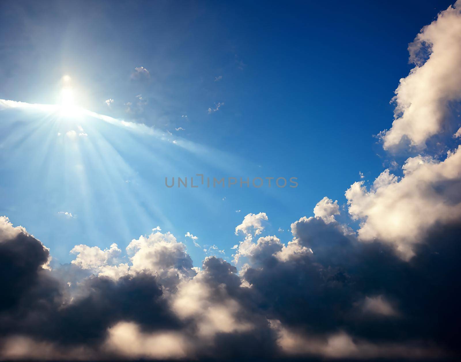 Blue sky with clouds and sun.