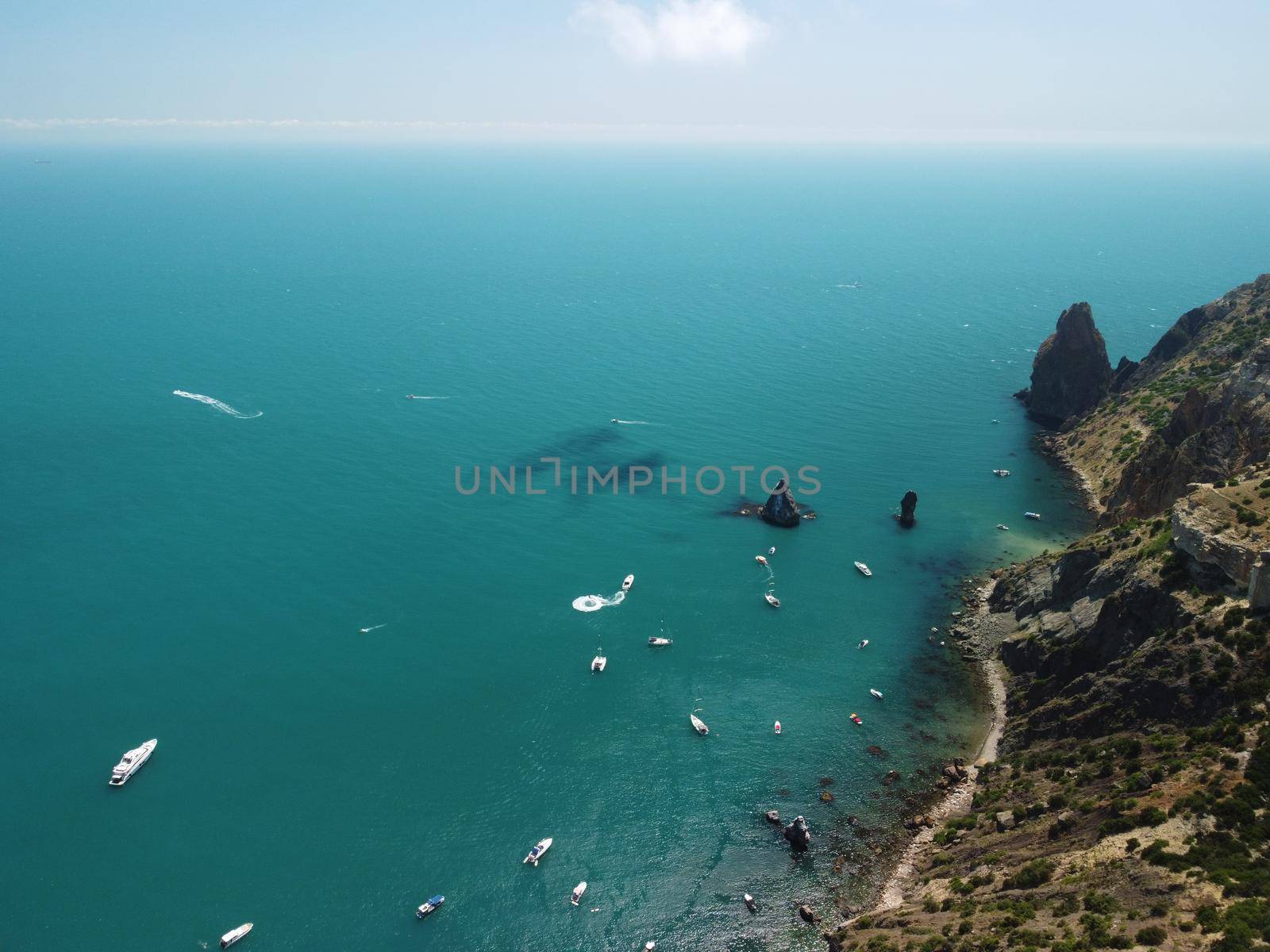 Aerial boat race. Luxury cruise trip. View from above of white boat on deep blue water. Aerial view of rich yacht sailing sea. Motor boat racing wave. Summer journey on luxury ship