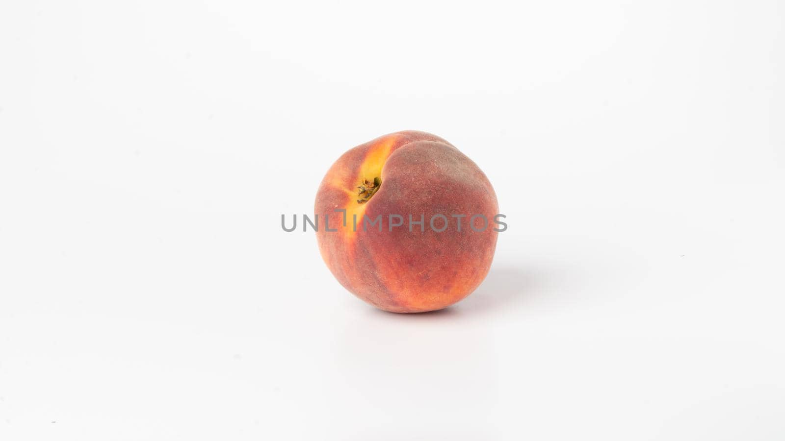 Peach close-up on white background healthy eating by voktybre