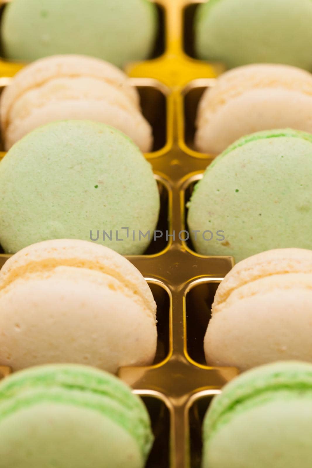 Row of colorful french macarons in the box. Traditional french dessert